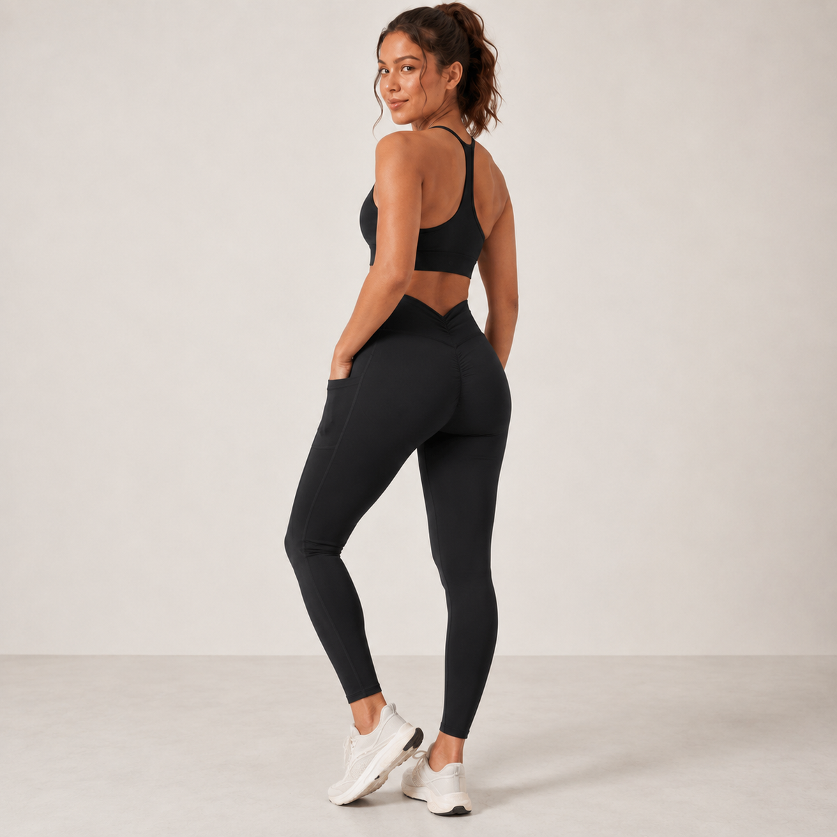 CurveLift Sculpt+ black leggings rear view with hand in pocket