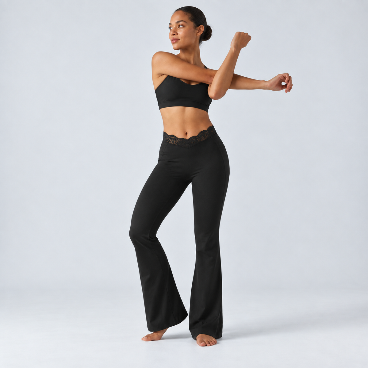 Liftiva LaceContour Flare Pants - Black - standing shoulder stretch